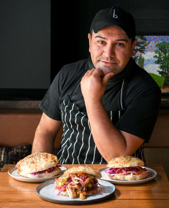Tulum owner-chef Coskun Uysal and his fish sandwiches. 