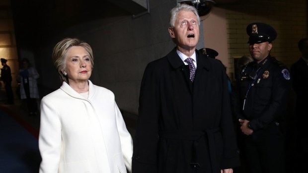 Hillary Clinton, left, and former U.S. President Bill Clinton arrive during the 58th presidential inauguration on January 20. 