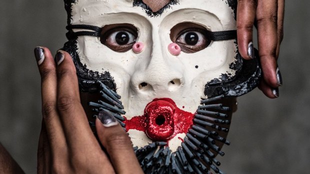 Performer Ponnaya Devi features in the Fringe Festival's opening masked ball.