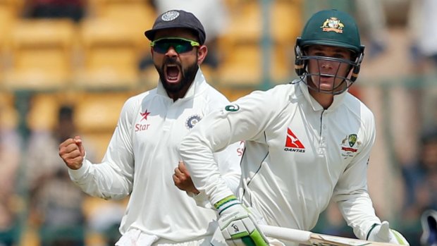 Virat Kohli (left) made up for his lack of runs with his talking game in the field.