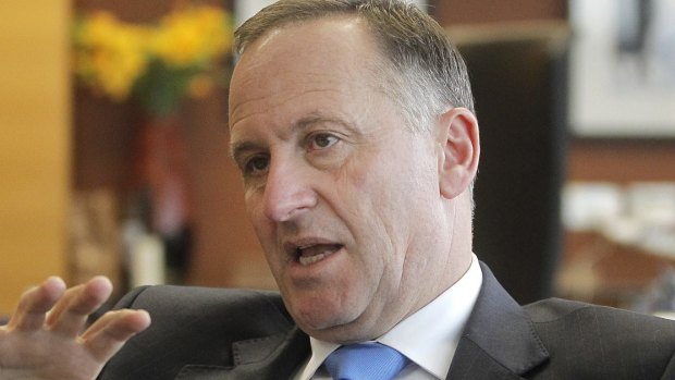 New Zealand Prime Minister John Key says people suspected of links with Islamic State want to make terrorist attacks in New Zealand, but are unlikely to because of the surveillance they are under.