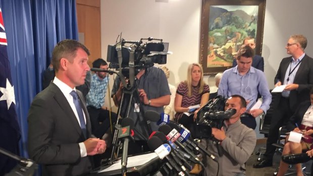 Premier Mike Baird at Tuesday's media conference announcing the reversal. 