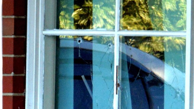 Bullet holes in the window of a shooting in Thomastown Tuesday morning.