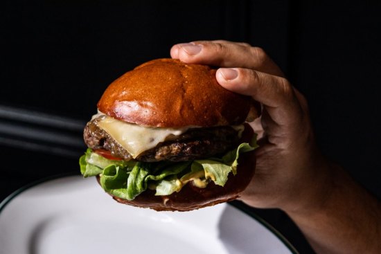 Le Burger Gruyere with tomato, mustard and fries at The Strand, Darlinghurst.