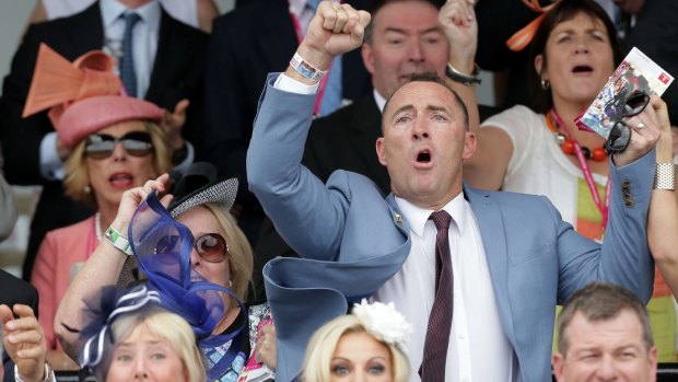 Part owner Jamie Lovett celebrates Protectionist's 2014 Melbourne Cup win.
