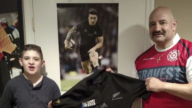 Prized possession: Phil Tufano and son Jake with the signed Sonny Bill Williams jersey
