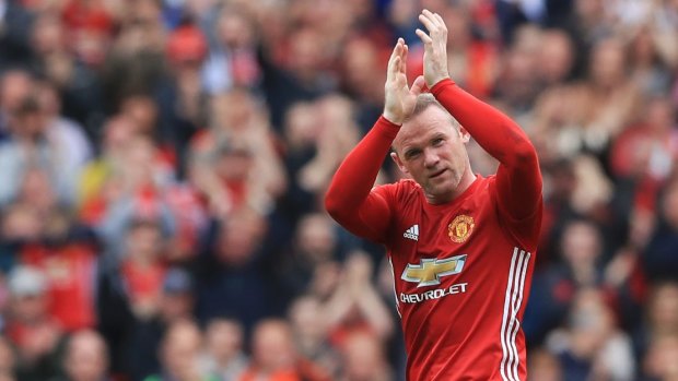 Wayne Rooney applauds the crowd at Old Trafford.