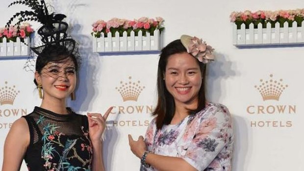 Tennis star Li Na (right) appears for Crown at a Melbourne Cup promotion in China, with fashion winner Elisha Song.