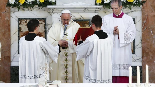 Pope Francis celebrates a mass during his pastoral visit to the Church of S. Maria Regina Pacis in Ostia, near Rome, on Sunday.