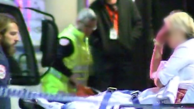 A woman attended to by paramedics near King Street nightclub Inflation.
