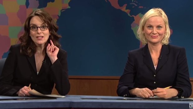 Tina Fey and Amy Poehler as Weekend Update news anchors on Saturday Night Live.