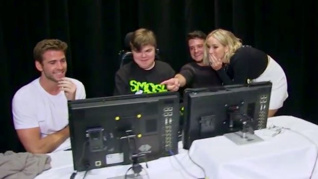 Liam Hemsworth, Dylan Miceli-Nelson and Josh Hutcherson with Jennifer Lawrence after their prank on Smosh during an interview for <i>The Hunger Games: Mockingjay - part 2</i>.