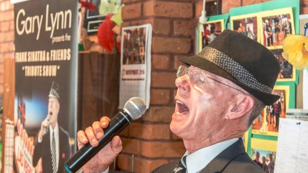 Performer Gary Lynn croons out an old Frank Sinatra classic.  