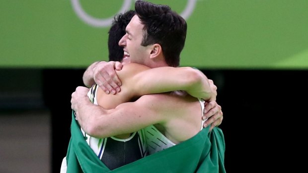 Brazilian gymnasts Diego Hypolito, right, and Arthur Mariano celebrate winning silver and bronze in the men's floor event in Rio.