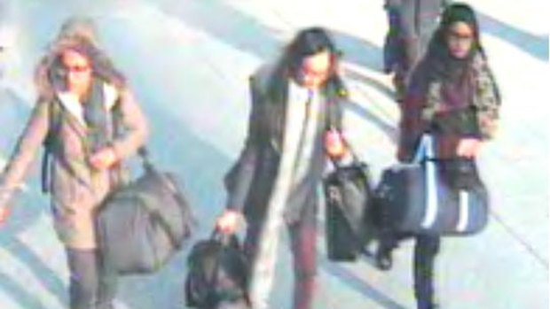 British teenage girls, from left, Amira Abase, Kadiza Sultana and Shamima Begun walk through Gatwick airport before they board a flight to Turkey on February 17, 2015. 