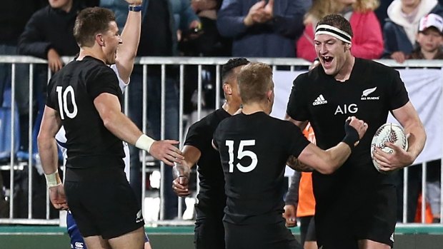 Black-out: Brodie Retallick celebrates scoring a try at QBE Stadium in Auckland.