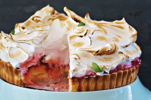 Lemon and raspberry-cardamom pie topped with wispy clouds of torched Italian meringue.