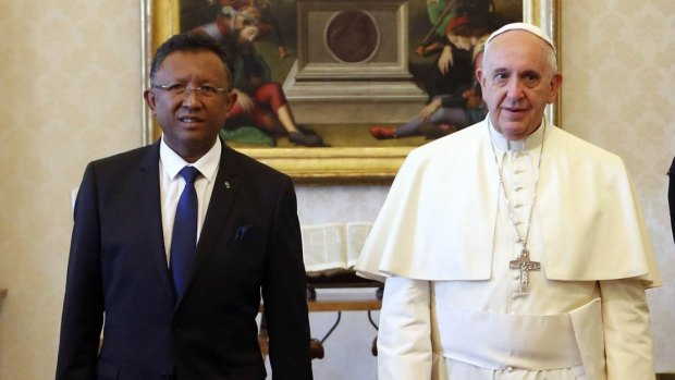 Pope Francis walks with Madagascan President Hery Rajaonarimampianina at the Vatican last year.