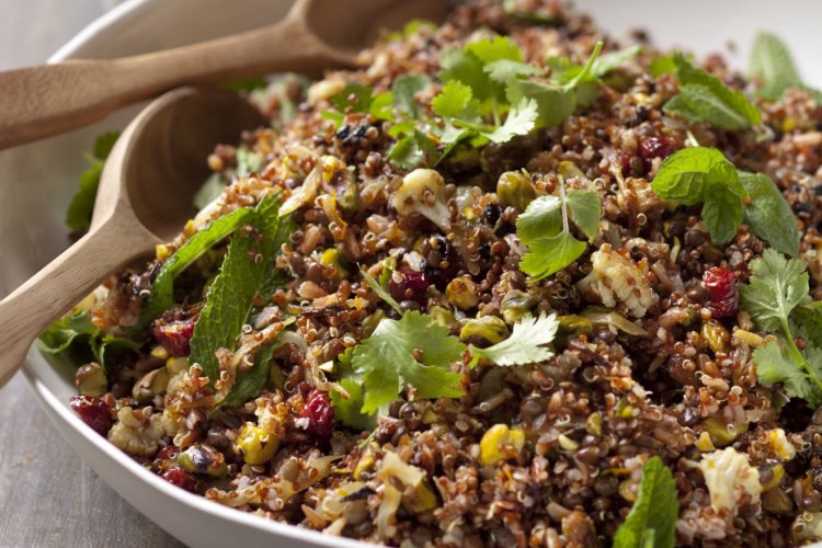 Quinoa and red rice salad with spicy cauliflower and black lentils.