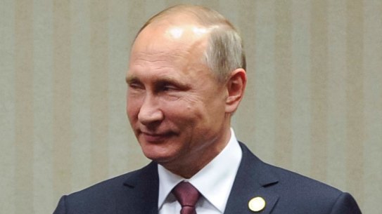 Japanese Prime Minister Shinzo Abe, left, shakes hans with Russian President Vladimir Putin during their meeting at the Asia-Pacific Economic Cooperation (APEC) forum in Lima, Peru, Sunday, Nov. 20, 2016. (Mikhail Klimentyev, Sputnik, Kremlin Pool Photo via AP)