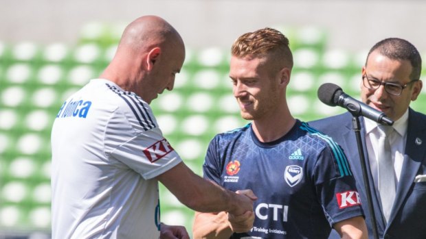 All yours: Kevin Muscat presents Oliver Bozanic with his Victory shirt.