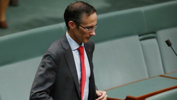 Labor MP Andrew Leigh jogs to his seat for question time on Monday.