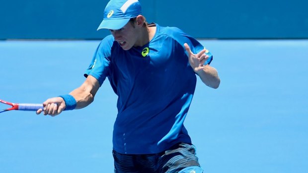 First-round victory: Alex De Minaur on his way to upsetting French Benoit Paire at the Sydney International.