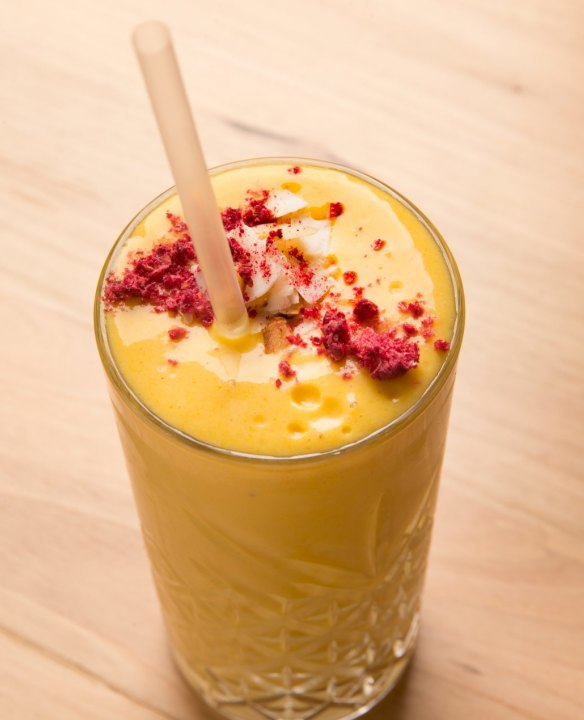 Mango smoothie with coconut yoghurt and milk, banana and turmeric.