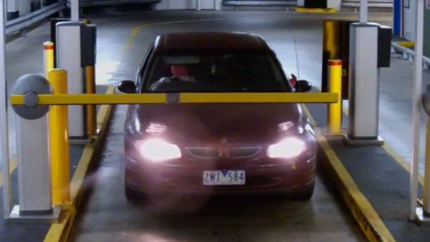 Three men leave the Canberra Centre in a Holden Commodore with stolen plates.