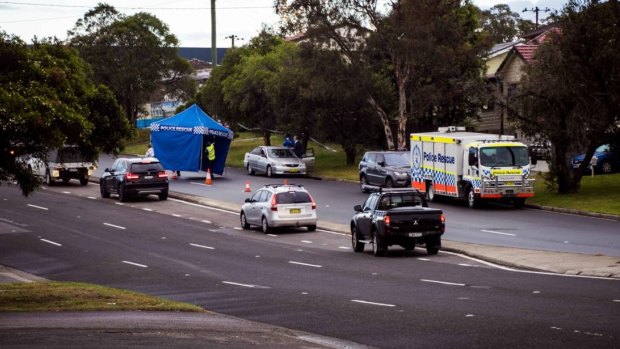 Police have set up a crime scene after finding the body of a man in the back seat of a car in Newcastle.