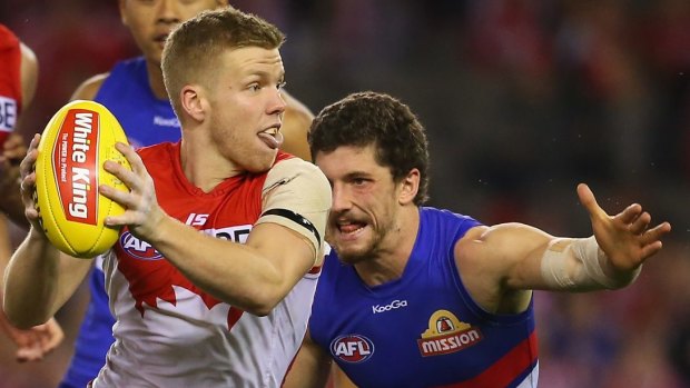 Manic midfields: Daniel Hannebery of the Swans and Tom Liberatore of the Bulldogs.