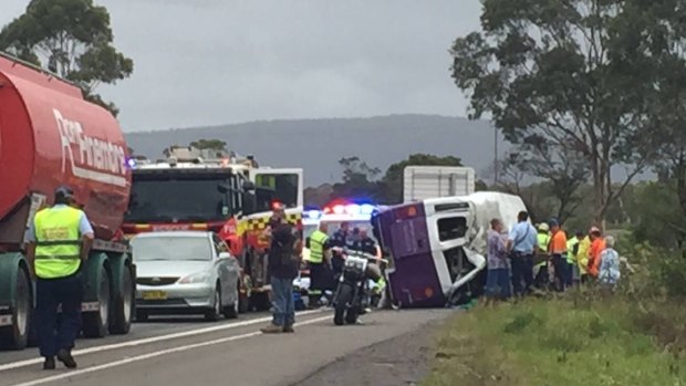 One person was killed and seven injured when a bus overturned on the M1 south of Wollongong.