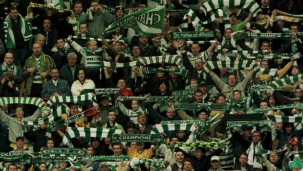 Scottish giants: Celtic fans applaud their team. 