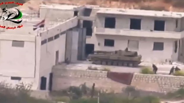 Footage supplied by the Fursan al-Haq Brigade shows a Syrian tank near Ariha, in Syria's Idlib province, moments before a TOW missile strike.