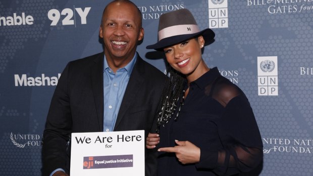 Bryan Stevenson, founder of the Equal Justice Initiative which is campaigning against sentencing children to life without parole with singer songwriter Alicia Keys whose "We Are Here" group are supporting their work.