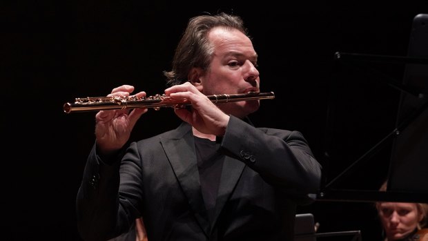 Flautist Emmanuel Pahud on stage with the Australian Chamber Orchestra.