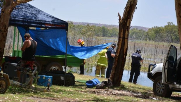 Police and QFES workers begin the search for nine-year-old Tobi Parkes after a jet ski accident at Lake Moondarra, in central Queensland.