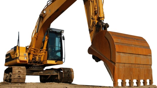 A man driving an excavator was crushed to death when it rolled last night.