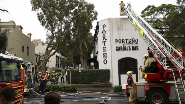 Firefighters extinguishing the blaze at Porteno, 2015.