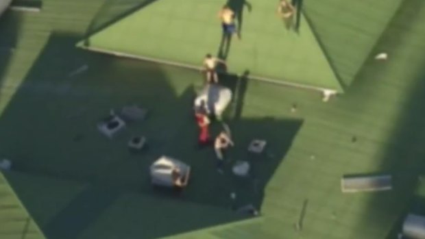 The shirtless youths on the roof of the Wacol detention centre.