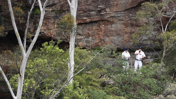 Police rescue officers near the site where a bushwalking track has collapsed.