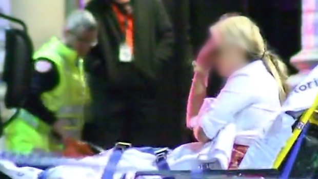 A woman attended to by paramedics near King Street nightclub Inflation.