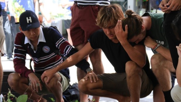 Most remained in near silence during the lunchtime gathering in Chinatown Mall to say goodbye to Cole Miller.