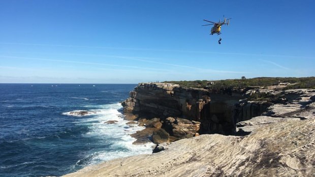 A helicopter retrieves the man's body at Kurnell.