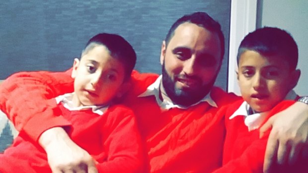 Omar Chandab, pictured with two of his four sons,  was prevented from flying to do the Hajj and then had his passport cancelled.