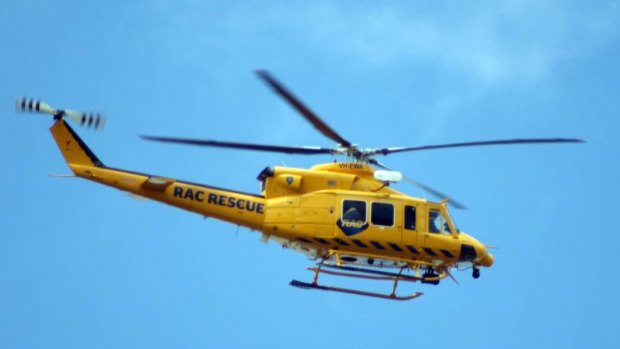 The RAC rescue helicopter has landed at a crash site near Gingin. 