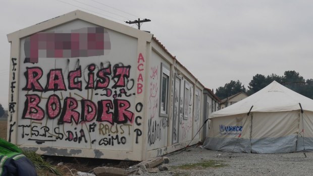 A sign near the Greek-Macedonia border where refugees who are not Syrian, Iraqis or Afghans are turned back.
