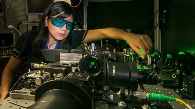 Rocio Camacho-Morales, a PhD candidate at the Australian National University. Here she adjusts the laser equipment in the laboratory of the Nonlinear Physics Centre at the ANU