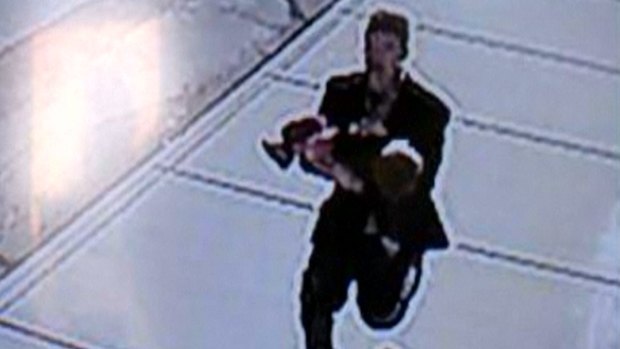 A toddler was grabbed by a man in Washington state but the boy was released when the child's siblings pursued the kidnapper, whose actions were caught on CCTV.