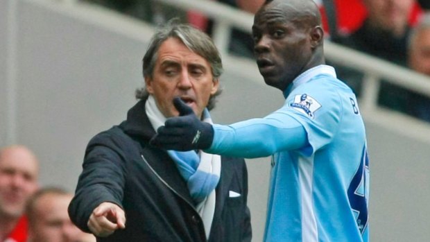 Candidate: Roberto Mancini, seen here in his days coaching Manchester City and talking with Mario Balotelli, is in the frame for the Socceroos job.
